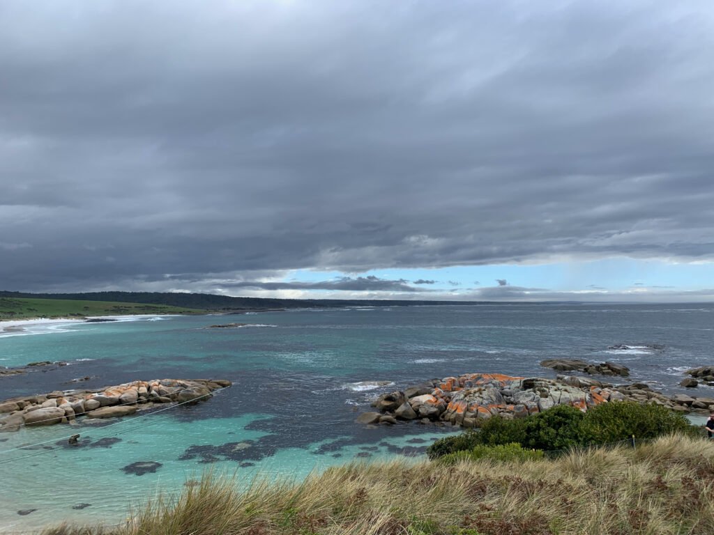 Grief Is Love and Pain, Walking Side by Side
bay of fires tasmania storm clouds over the sea
